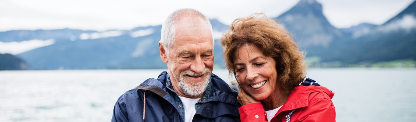 Couple taking selfie by mountain